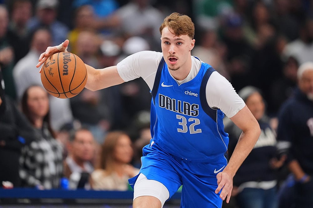 Dallas Mavericks forward Cooper Flagg dribbles the ball up court against the Miami Heat during the first half of an NBA basketball game in Dallas.  - | Photo: AP/Julio Cortez