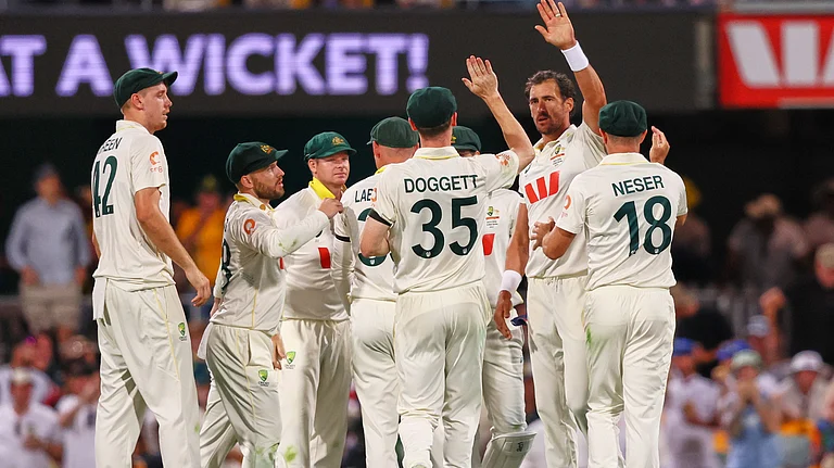 Australia's Mitchell Starc celebrates with teammates the wicket of England's Will Jacks during the second Ashes Test match on December 4, 2025. - | Photo: AP/Tertius Pickard