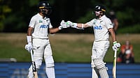 | Photo: AP/Andrew Cornaga                                           : New Zealand's batters Rachin Ravindra and Tom Latham encourage each other while batting against the West Indies on day 3 during their cricket test match in Christchurch, New Zealand, Thursday, Dec. 4, 2025. 
