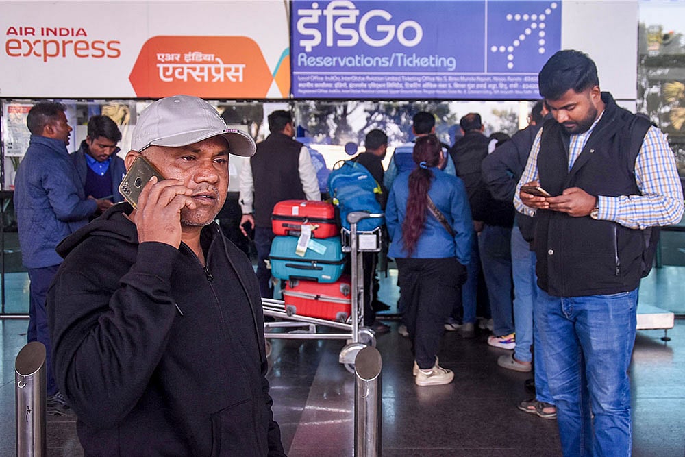 Ranchi: Passengers gather to enquire at an IndiGo airlines counter amid flight cancellations, at Birsa Munda International Airport in Ranchi, Friday, Dec. 5, 2025. India's largest airline IndiGo's operations crumbled as pilot-rostering issues continued to force large scale flight cancellations, over 400 on Friday. (PTI Photo)() - Photo: PTI