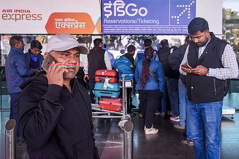 Passengers gather to enquire at an IndiGo airlines counter amid flight cancellations, at Birsa Munda International Airport in Ranchi. India's largest airline IndiGo's operations crumbled as pilot-rostering issues continued to force large scale flight cancellations, over 400 on Friday.