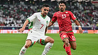 Oman 0-0 Morocco LIVE Score, FIFA Arab Cup: Atlas Lions Go Down To 10 Men Against Spirited Al-Ahmar | Photo: X/EnMaroc : Comoros' Musab Al-Mamari challenges for the ball against Morocco's Mohamed Boulacsout during their FIFA Arab Cup match on December 5, 2025.