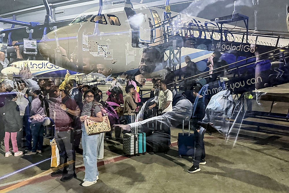 An IndiGo flight from Raipur lands at Chhatrapati Shivaji Maharaj International Airport's Terminal 2, in Mumbai. Passengers were left stranded as IndiGo cancelled numerous flights while struggling to meet new crew rostering rules, a day after it scrapped several services and announced schedule adjustments. - Photo: PTI/Kunal Patil