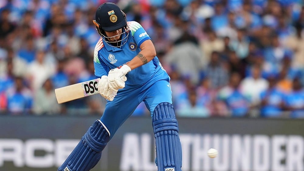 Crowd cheer after India's Shafali Verma hits a six during the ICC Women's Cricket World Cup final match between India and South Africa in Navi Mumbai. - | Photo: AP/Rafiq Maqbool
