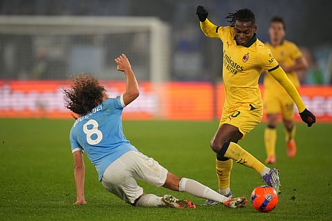 Lazio's Matteo Guendouzi tackles AC Milan's Rafael Leao during the Italian Cup round of sixteen soccer match between Lazio and Milan, in Rome.