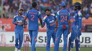 Photo: AP : India Vs South Africa Live Cricket Score, 3rd ODI: Kuldeep Yadav celebrates with teammates the wicket of Marco Jansen in Visakhapatnam.