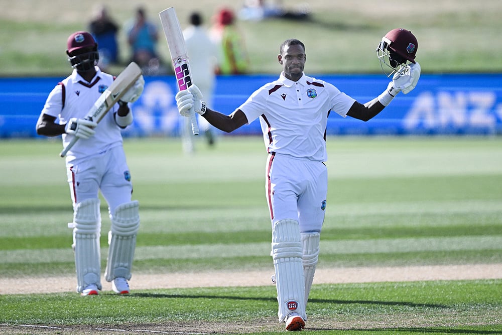 West Indies' Justin Greaves, right, raises his bat after scoring 200 runs against New Zealand on Day 5 of their cricket test match in Christchurch, New Zealand. - | Photo: Andrew Cornaga/Photosport via AP