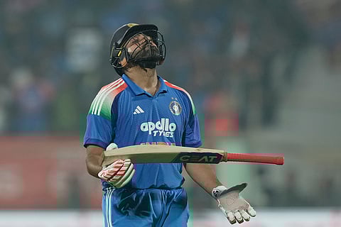 India's Rohit Sharma reacts while leaves the field after losing his wicket during the third One Day International cricket match between India and South Africa in Visakhapatnam.