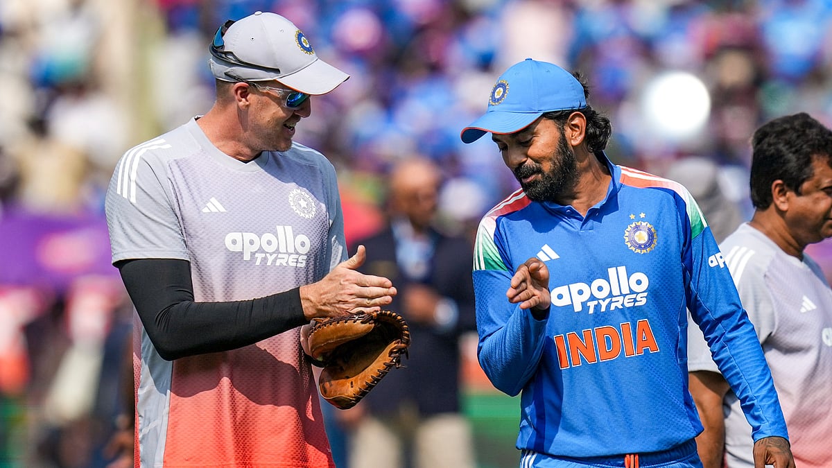 KL Rahul gestures to bowling coach Morne Morkel after winning the toss for the third ODI between India and South Africa in Visakhapatnam. - PTI/Shailendra Bhojak