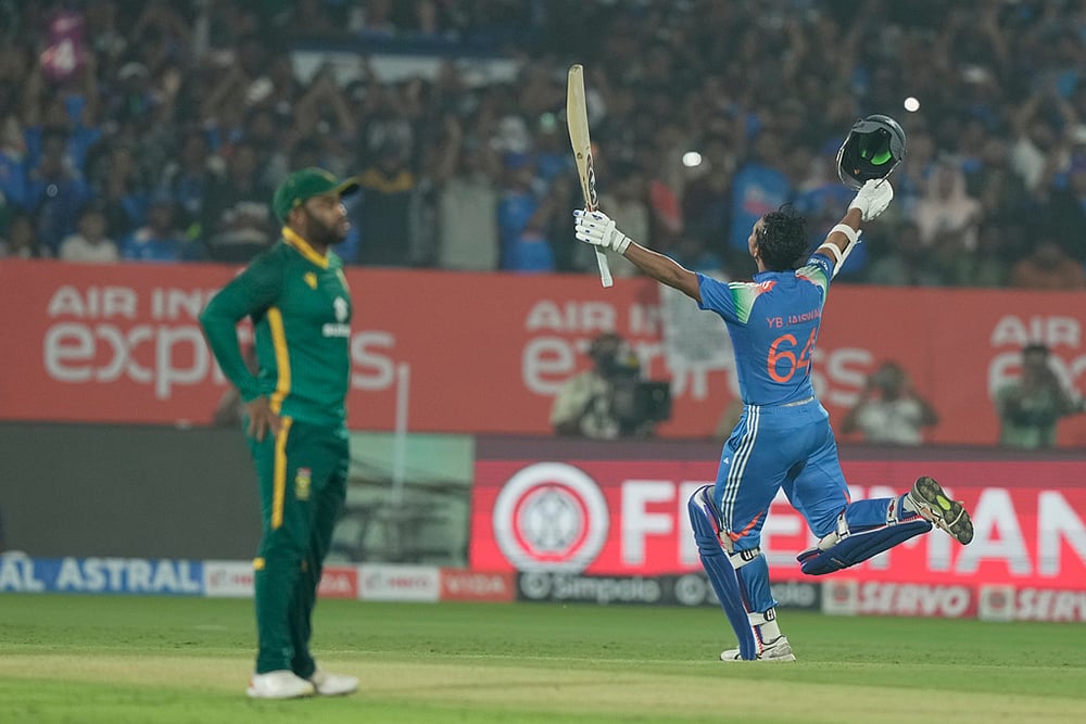 India's Yashasvi Jaiswal celebrates his century during the third One Day International cricket match between India and South Africa in Visakhapatnam. - | Photo: AP/Mahesh Kumar A.
