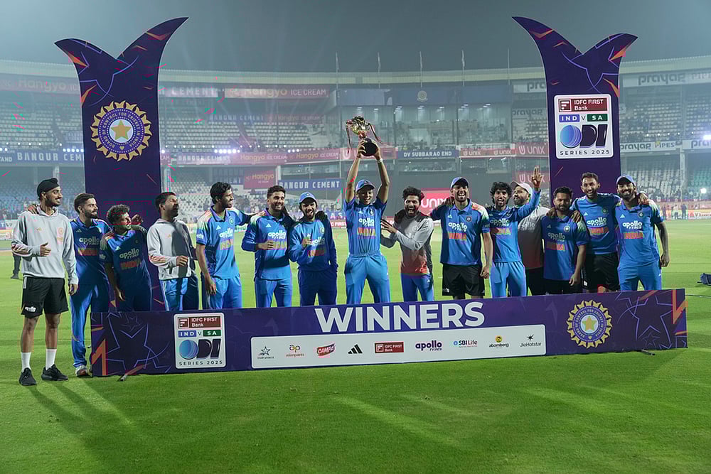 | Photo: AP/Mahesh Kumar A. : Indian players pose with the trophy after winning the third One Day International cricket match against South Africa in Visakhapatnam. India won the series by 2-1.