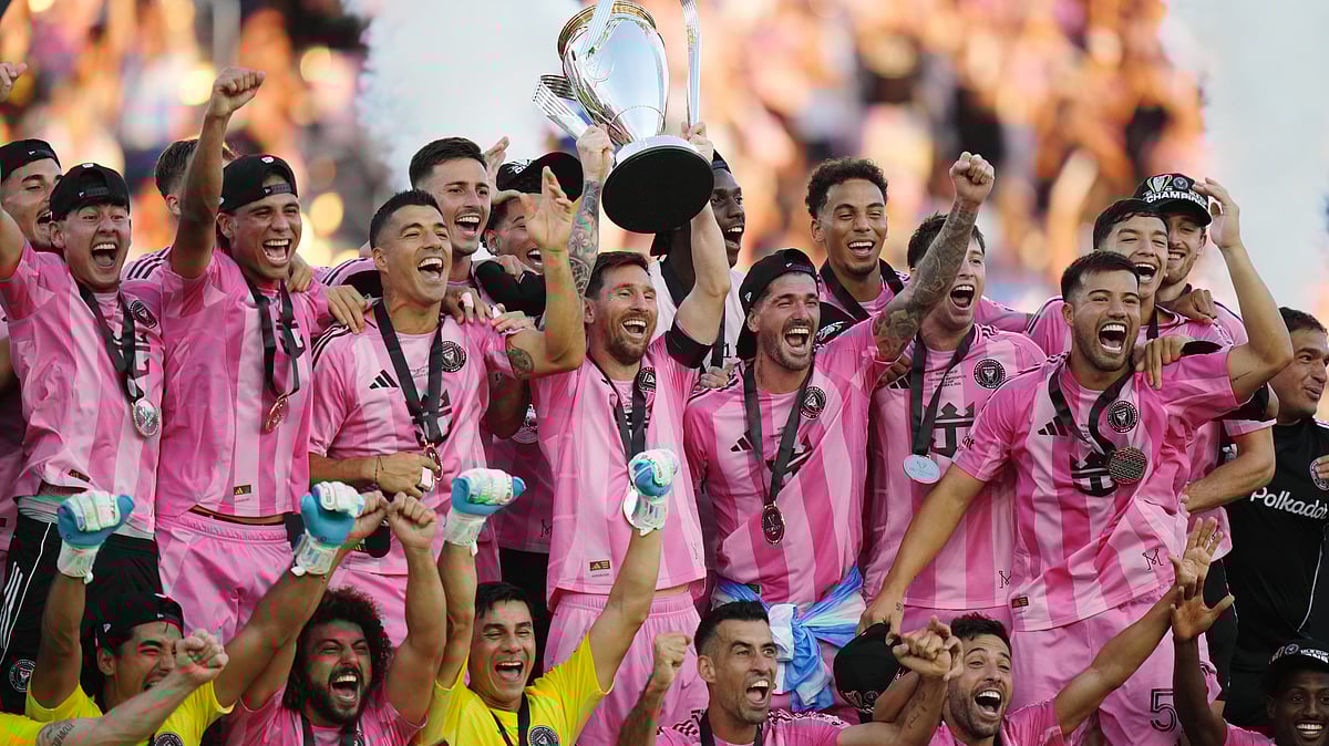 Inter Miami's Lionel Messi hoists the trophy alongside teammates after defeating the Vancouver Whitecaps in the MLS Cup final match on December 6, 2025. - | Photo: The Canadian Press/Darryl Dyck via AP