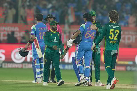 India's Virat Kohli and Yashasvi Jaiswal shakes hand with South Africa players after India won third One Day International cricket match in Visakhapatnam.