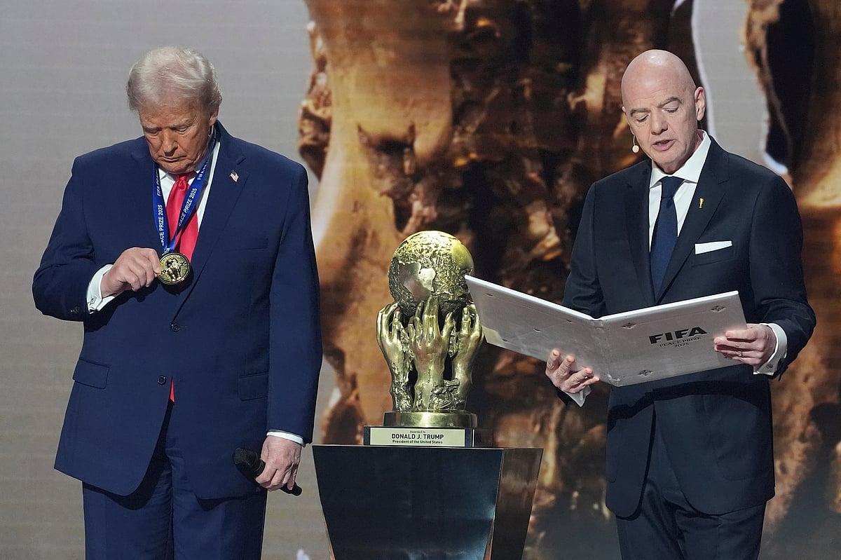 President Donald Trump is presented with the inaugural FIFA Peace Prize by FIFA President Gianni Infantino during the 2026 FIFA World Cup draw at the Kennedy Center, Friday, Dec. 5, 2025, in Washington. - AP Photo/ Evan Vucci 