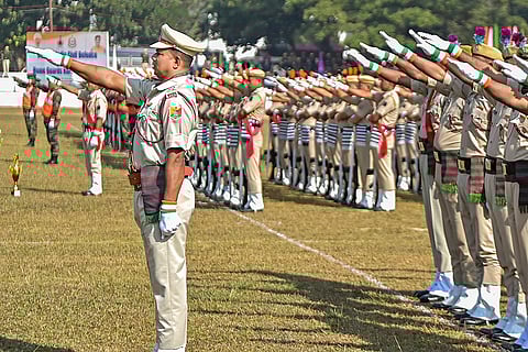 Security personnel take a pledge during the 63rd All India Civil Defence and Home Guard Day celebrations, in Agartala, Tripura.