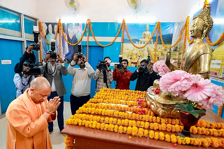 Uttar Pradesh Chief Minister Yogi Adityanath pays tribute to Lord Buddha during the 69th death anniversary of Babasaheb Ambedkar, also called ‘Mahaparinirvan Diwas’, at Bhimrao Ambedkar Mahasabha Office Complex, Hazratganj, in Lucknow. - | Photo: Handout via PTI