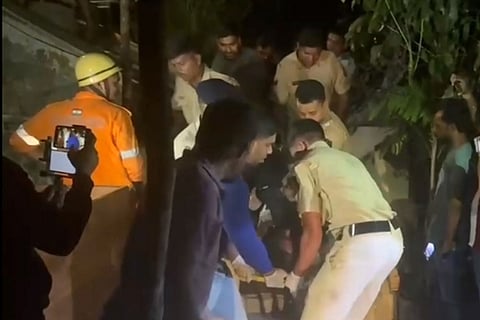 A victim being rescued after a fire broke out following a cylinder blast at a nightclub late Saturday night, in North Goa. At least 23 persons were killed in the incident, according to officials.