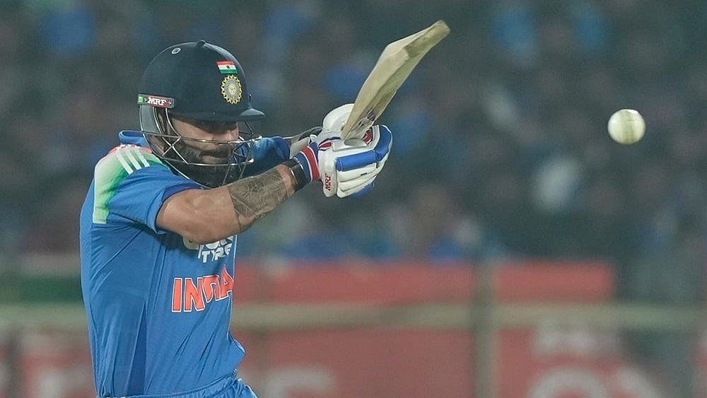 India's Virat Kohli plays a shot during the third One Day International cricket match between India and South Africa in Visakhapatnam. - | Photo: AP/Mahesh Kumar A.