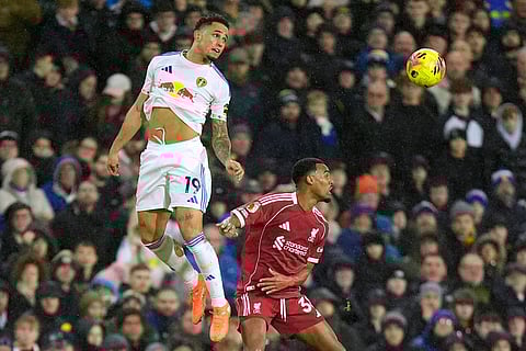 Leeds United's Noah Okafor, left, and Liverpool's Ryan Gravenberch in action during the English Premier League soccer match between Leeds United and Liverpool in Leeds, England.