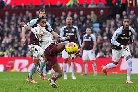 Arsenal's Jurrien Timber kicks the ball during the English Premier League soccer match between Aston Villa and Arsenal in Birmingham, England.