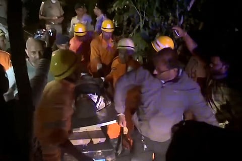 A victim being rescued after a fire broke out following a cylinder blast at a nightclub  in North Goa. At least 23 persons were killed in the incident, according to officials. 