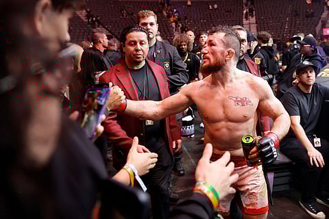 Former UFC bantamweight champion Merab Dvalishvili intracts with fans after losing his title to Petr Yan during UFC 323 in Las Vegas.