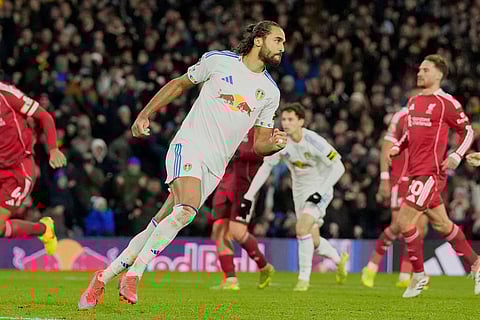Leeds United's Dominic Calvert-Lewin celebrates scoring during the English Premier League soccer match between Leeds United and Liverpool in Leeds, England.
