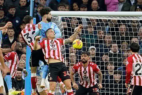 Manchester City's Josko Gvardiol, second left, scores his side's second goal during the English Premier League soccer match between Manchester City and Sunderland in Manchester, England.