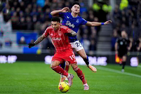 Nottingham Forest's Igor Jesus, left, and Everton's Carlos Alcaraz in action during the English Premier League soccer match between Everton and Nottingham Forest in Liverpool, England.