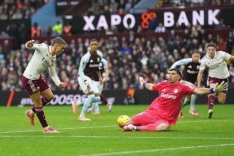 Arsenal's Leandro Trossard, left, makes an attempt to score during the English Premier League soccer match between Aston Villa and Arsenal in Birmingham, England.