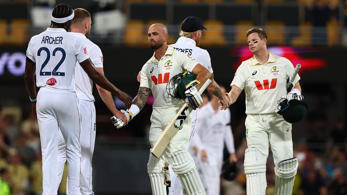 Australia's Jake Weatherald, front, and Australia's captain Steve Smith shake hands with England's players after winning the second Ashes Test. - AP