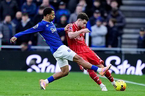 Nottingham Forest's Neco Williams, right, and Everton's Iliman Ndiaye in action during the English Premier League soccer match between Everton and Nottingham Forest in Liverpool, England