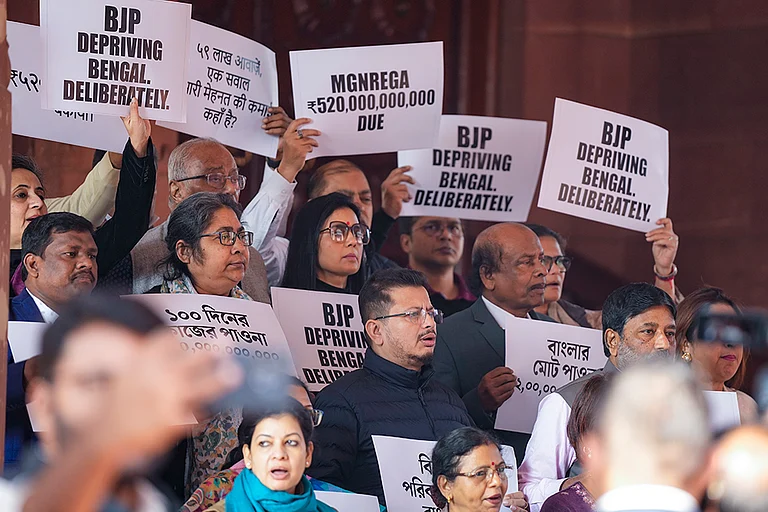 TMC MPs Mahua Moitra, Dola Sen and others stage a protest over the issue of pending Central dues for West Bengal, during the Winter session of Parliament, in New Delhi. - | Photo: PTI/Salman Ali
