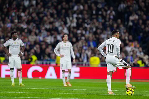Real Madrid's Kylian Mbappe reacts after Celta's Williot Swedberg scored the opening goal during the Spanish La Liga soccer match between Real Madrid and Celta Vigo in Madrid, Spain.
