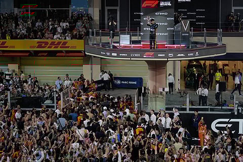 McLaren driver Lando Norris of Britain reacts after becoming a world champion after the Formula One Abu Dhabi Grand Prix at the Yas Marina Circuit in Abu Dhabi, UAE.
