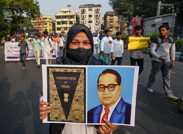 A student of Aliha University shows a placard during a protest rally demanding simplification of the process of including Waqf properties in the Waqf Portal and increasing of the time limit, in Kolkata, Thursday, Dec. 4, 2025. - Manvender Vashist Lav