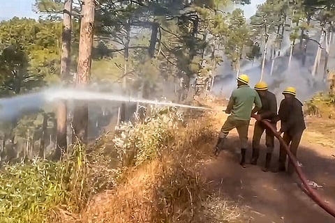 Firefighters attempt to douse a forest fire, in Jammu. Forest fire continues to spread at multiple locations along the Line of Control (LoC) in Rajouri and Poonch districts of Jammu and Kashmir amid dry conditions and lack of rainfall.