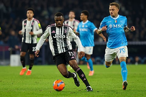 Juventus' Pierre Kalulu, centre, controls the ball during the Serie A soccer match between Napoli and Juventus, in Naples, Italy.