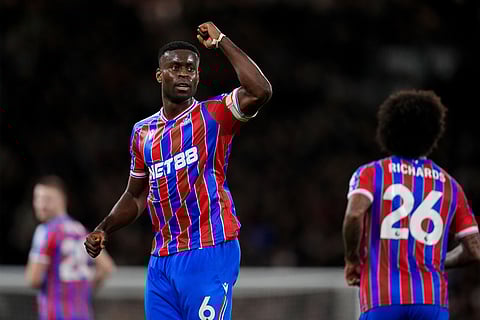 Crystal Palace's Marc Guehi celebrates after scoring his sides second goal during the English Premier League soccer match between Fulham and Crystal Palace, in London.