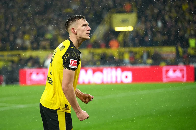 Borussia's Nico Schlotterbeck celebrates after scoring his side's second goal during Germany Bundesliga soccer match between Borussia Dortmund and TSG 1899 Hoffenheim, in Dortmund, Germany. - | Photo: Bernd Thissen/dpa via AP