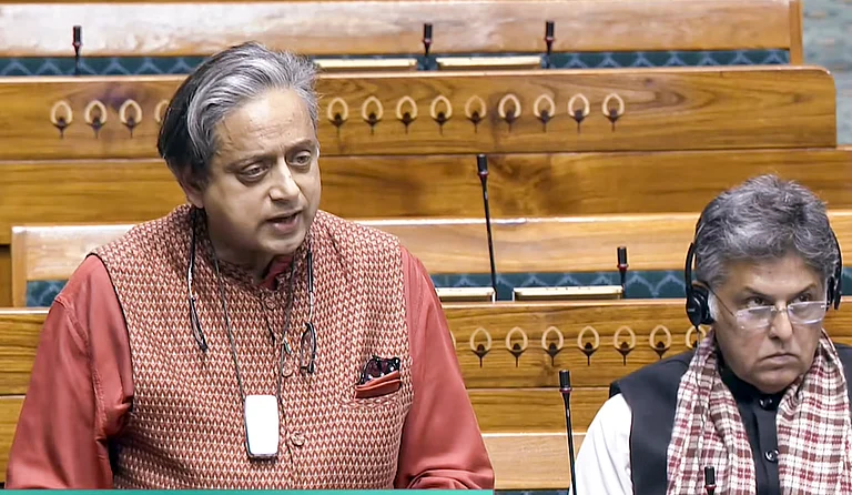 Congress MP Shashi Tharoor speaks in the Lok Sabha during the Winter session of Parliament. - PTI