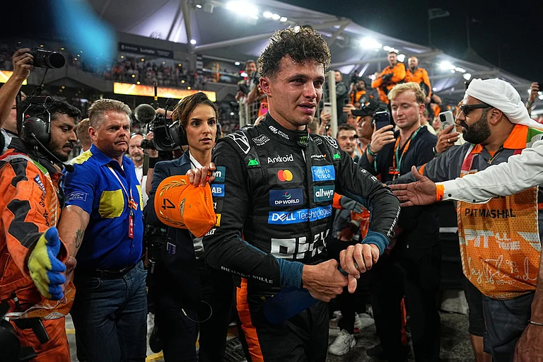 New Formula One World Champion McLaren driver Lando Norris of Britain leaves the track after the Formula One Abu Dhabi Grand Prix at the Yas Marina Circuit in Abu Dhabi, UAE. - | Photo: AP/Fatima Shbair