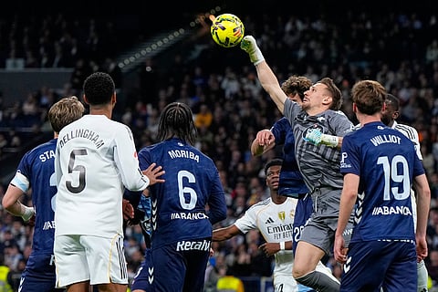 Celta's goalkeeper Ionut Radu makes a save during the Spanish La Liga soccer match between Real Madrid and Celta Vigo in Madrid, Spain.