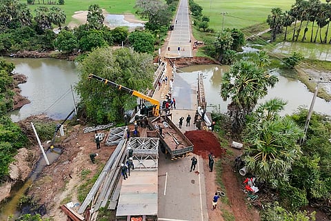 In this image posted on Dec. 7, 2025, Army officials from India and Sri Lanka, along with Road Development Authority conduct a restoration operation on the Paranthan–Karachchi–Mullaitivu (A35) road in Kilinochchi as part of the Operation Sagar Bandhu in Sri Lanka.