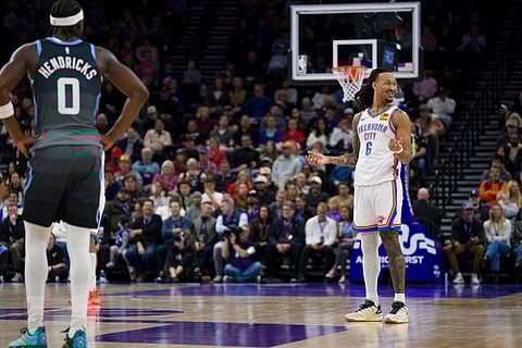 Oklahoma City Thunder forward Jaylin Williams (6) reacts to a call as Utah Jazz forward Taylor Hendricks (0) looks on during the first half of an NBA basketball game in Salt Lake City. 