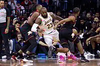 | Photo: AP/Chris Szagola : Los Angeles Lakers' LeBron James, center, gets the ball stolen by Philadelphia 76ers' Tyrese Maxey, right, as Jabari Walker, left, is defending during the second half of an NBA basketball game in Philadelphia.