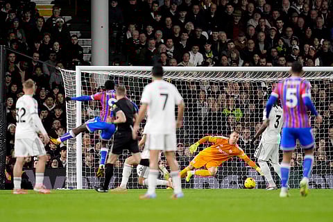 Crystal Palace's Eddie Nketiah, second left, scores his sides first goal during the English Premier League soccer match between Fulham and Crystal Palace, in London.