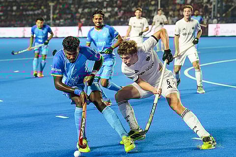 India's Bennur Sunil Palakshappa (17) and Germany's Hoffmann Lenn (5) vie for the ball during the semi-final match of the FIH Hockey Men’s Junior World Cup 2025, at Mayor Radhakrishnan Hockey Stadium in Chennai.