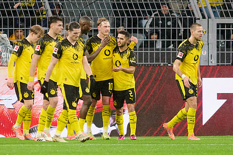Borussia's Julian Brandt, third from right, celebrates with teammates after scoring the opening goal during Germany Bundesliga soccer match between Borussia Dortmund and TSG 1899 Hoffenheim, in Dortmund, Germany.