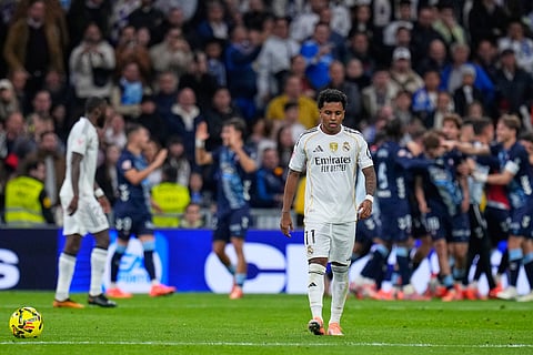 Real Madrid's Rodrygo reacts after Celta's Williot Swedberg scored his side's second goal during the Spanish La Liga soccer match between Real Madrid and Celta Vigo in Madrid, Spain.